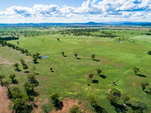 Aerial photo of green farm paddock on Aussie farm - Australian Stock Image