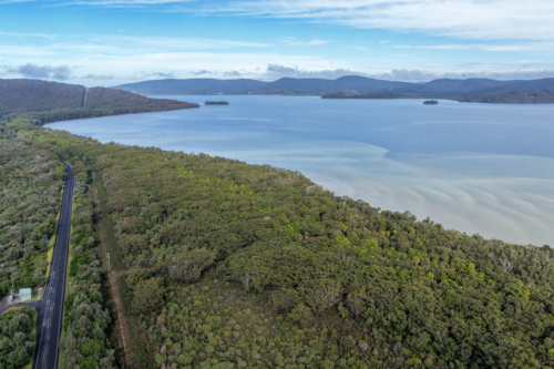 Aerial scene capturing Wallis Lake and Booti Hill and surrounding landscape - Australian Stock Image
