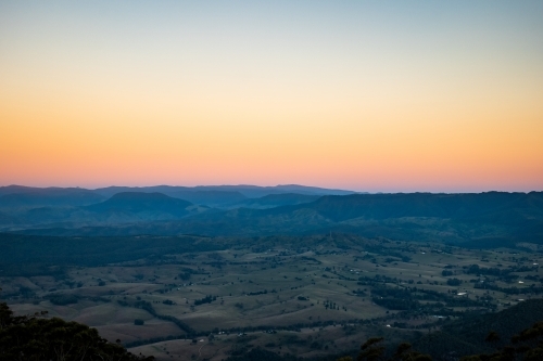 Aerial shot of a plain with yellow and orange skies - Australian Stock Image
