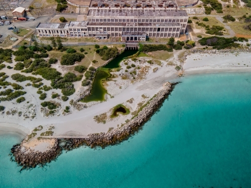 Aerial shot of abandoned power station on coast line - Australian Stock Image