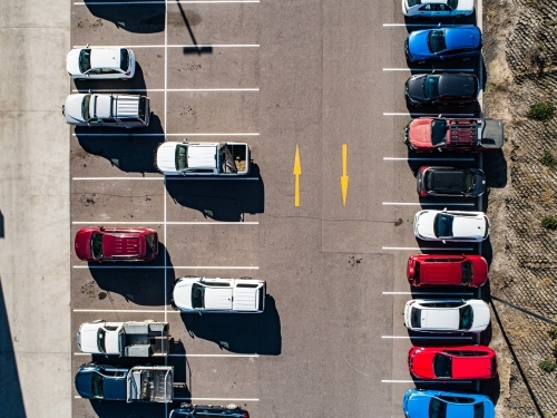 Aerial shot of cars parked in carpark with empty spaces - Australian Stock Image