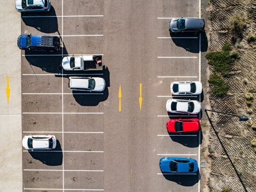Aerial shot of cars parked in carpark with empty spaces - Australian Stock Image