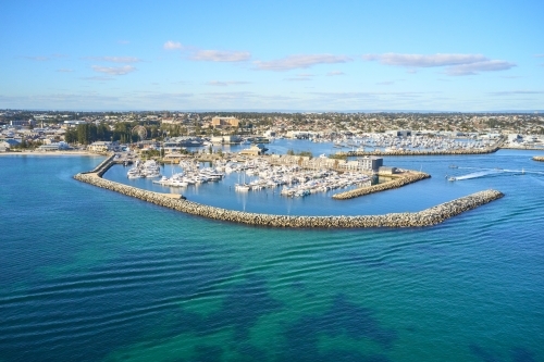 Aerial shot of Fremantle's Challenger Harbour on a sunny day with boats, yachts and groyne - Australian Stock Image