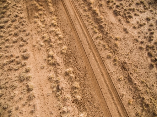 Aerial shot of dirt road in a paddock - Australian Stock Image