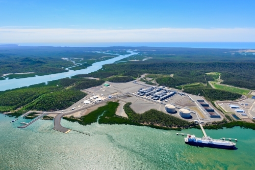 Aerial shot of liquified natural gas plant and LNG ship on Curtis Island, Queensland - Australian Stock Image
