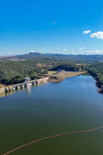 Aerial vertical view showcasing the Lake Keepit dam wall, engineering infrastructure and landscape - Australian Stock Image