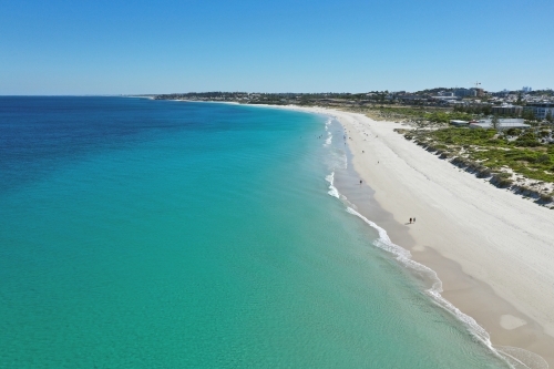 Aerial view along the ocean water at Leighton Beach on a clear summer morning, in Perth..