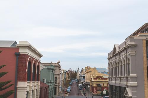 Aerial view down street of street with old buildings - Australian Stock Image