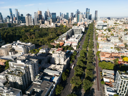 Aerial view looking along Victoria Parade road towards the Melbourne CBD - Australian Stock Image