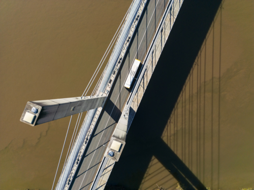 Aerial view looking down pylons at the surface of the the Eleanor Schonell Bridge - Australian Stock Image