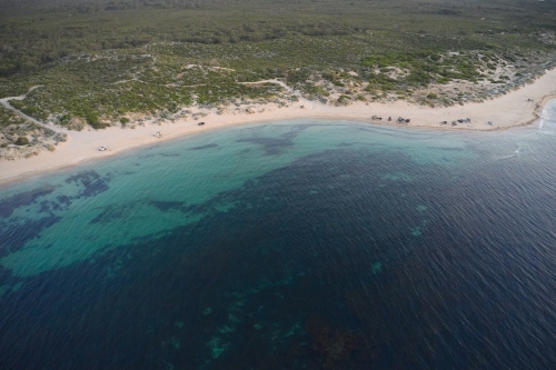 Aerial view of 4wd beach in Western Australia, with many  vehicles enjoying a summer evening