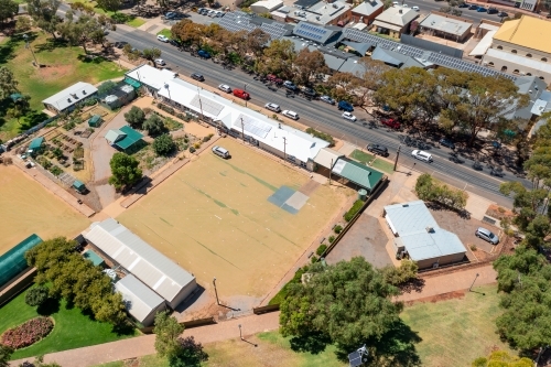 Aerial view of a bowling green and surrounding park in an out back town setting