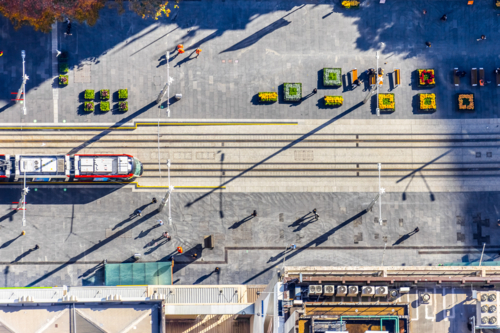 Aerial view of a city tramway and pedestrian plaza - Australian Stock Image