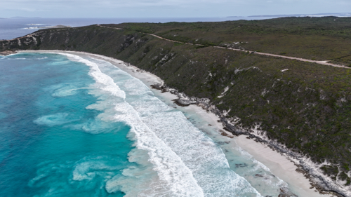 Aerial view of a coastal landscape with a long stretch of rugged cliffs - Australian Stock Image
