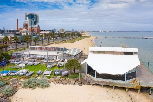 Aerial view of a coastal yacht club over a beach - Australian Stock Image