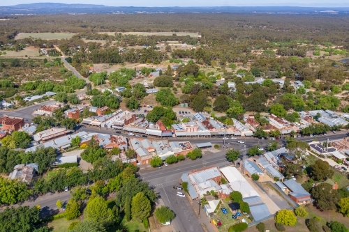 Aerial view of a country town main street lined with historic buildings