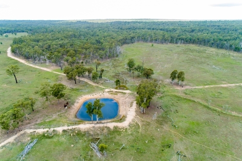 Aerial view of a farm dam and paddock. - Australian Stock Image