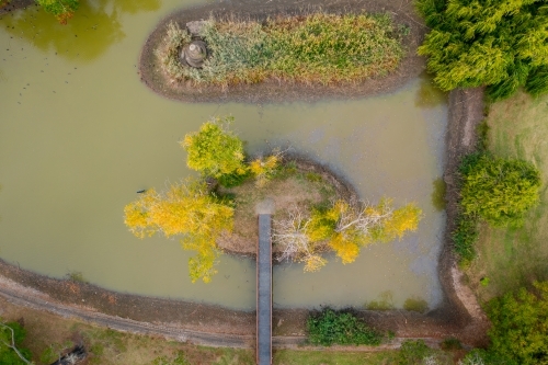 Aerial view of a garden lake with islands in Autumn - Australian Stock Image