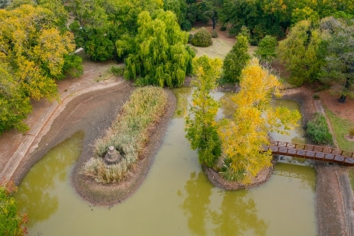 Aerial view of a garden lake with islands in Autumn - Australian Stock Image