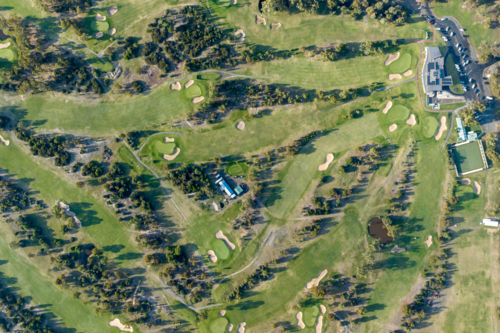 Aerial view of a golf course with clubhouse and bowling green - Australian Stock Image