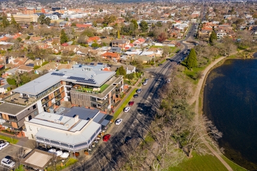 Aerial view of a hotel complex on a busy lakeside road - Australian Stock Image