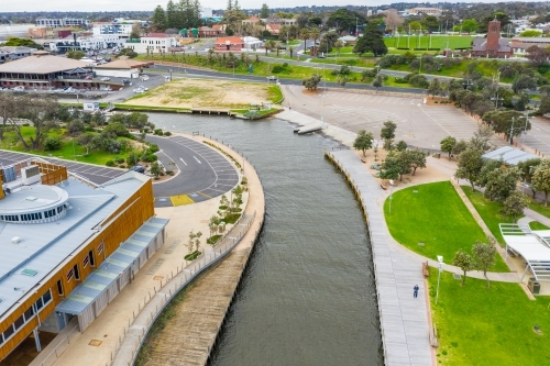 Aerial view of a marina channel cutting and car park. - Australian Stock Image