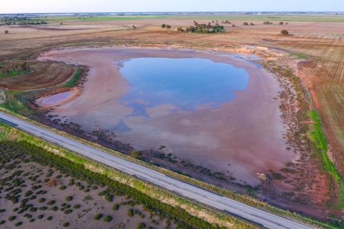 Aerial view of a roadside salt lake with colourful salt crusted edges - Australian Stock Image