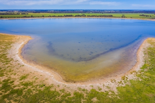 Aerial view of a shallow bay around the shoreline of an inland lake