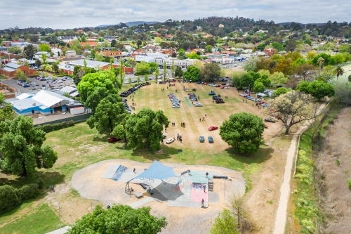 Aerial view of a skate park and car rally on a country town cricket oval - Australian Stock Image