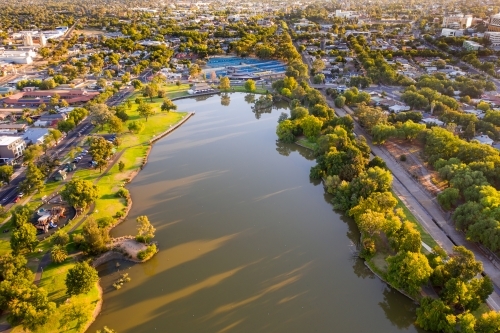 Aerial view of an city lake surrounded by trees - Australian Stock Image