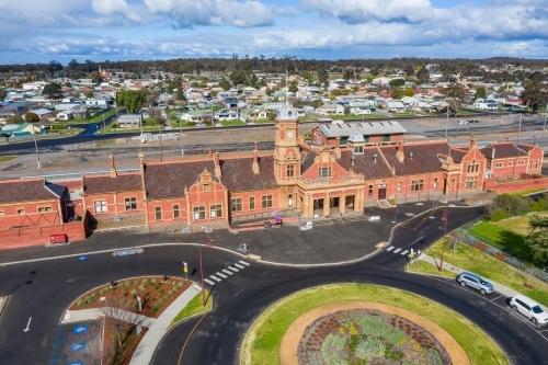 Aerial view of an historic railway station near a roundabout - Australian Stock Image