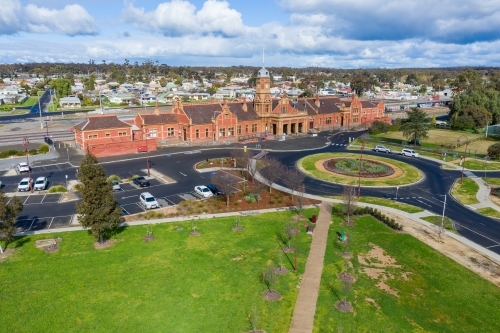 Aerial view of an historic railway station near a roundabout - Australian Stock Image