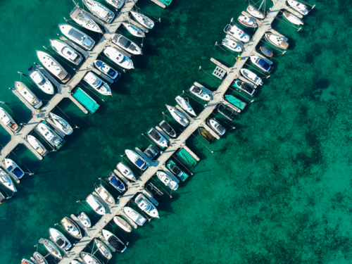 Aerial view of boats and yachts moored on jetties - Australian Stock Image