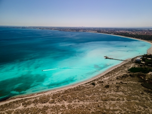 Aerial view of clear waters along coast line with Woodman Point Jetty