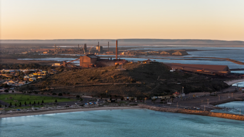 Aerial view of coastal town at sunset - Australian Stock Image
