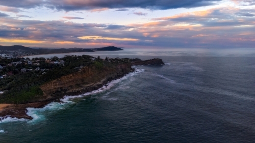 Aerial view of coastline at sunset