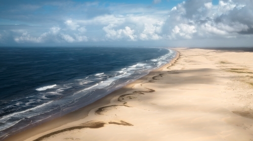 Aerial view of coastline beach with sand dunes