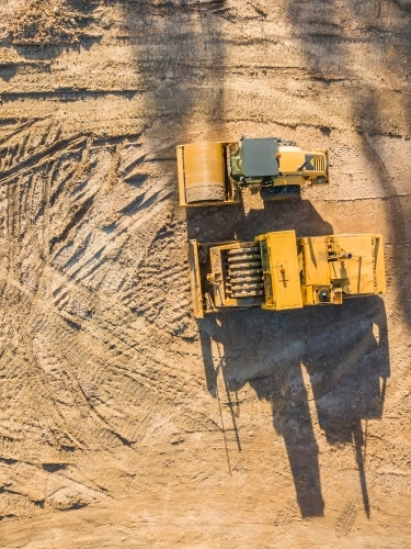 Aerial view of earthmoving machinery on a construction site - Australian Stock Image