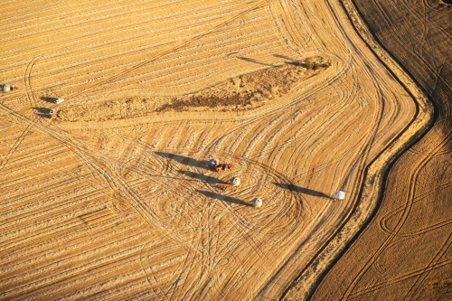 aerial view of field bins in harvested paddock - Australian Stock Image