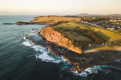 Aerial view of Gerringong headland and rocky coastline - Australian Stock Image