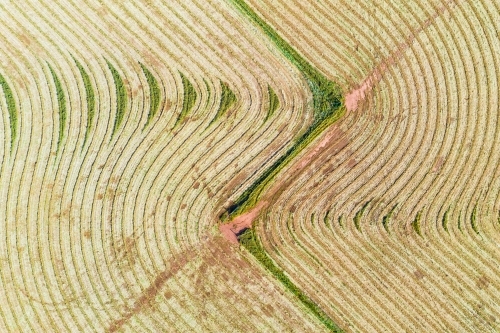 Aerial view of harvesting patterns in an empty paddock - Australian Stock Image