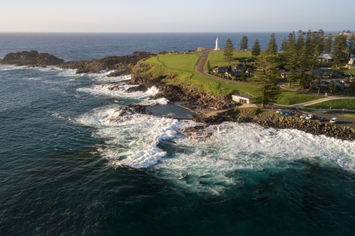 Aerial view of headland and lighthouse