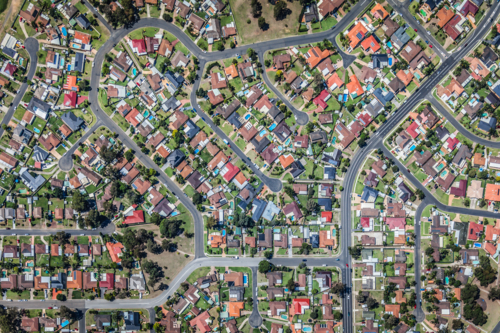 Aerial view of high-density suburban neighbourhood in maze-like residential area - Australian Stock Image