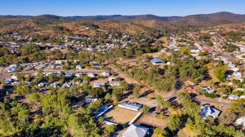 Aerial view of houses near the mountains - Australian Stock Image