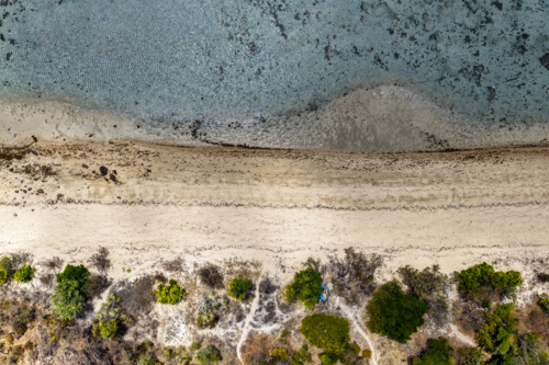 Aerial view of Hydeaway Bay showcasing its water, and beach - Australian Stock Image