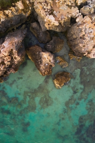 Aerial view of limestone cliff and clear blue water at Henderson Cliffs, Perth, Western Australia - Australian Stock Image