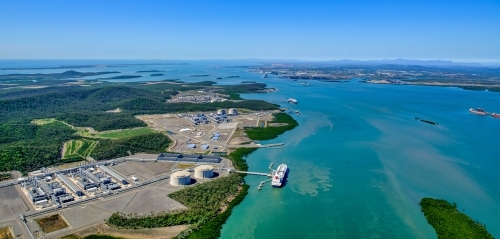 Aerial view of liquified natural gas plant and LNG ship on Curtis Island, Queensland - Australian Stock Image