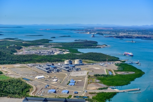 Aerial view of liquified natural gas plant and LNG ship on Curtis Island, Queensland - Australian Stock Image