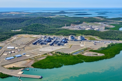 Aerial view of liquified natural gas plant and LNG ship on Curtis Island, Queensland - Australian Stock Image