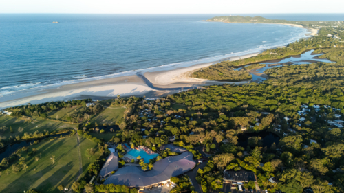 Aerial view of long stretch of white sand beach - Australian Stock Image